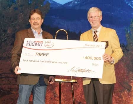 Larry Potterfield (right), presenting David Allen, President and CEO of RMEF, with a donation to support the creation of the SAFE Challenge Program at the 2011 RMEF Convention.