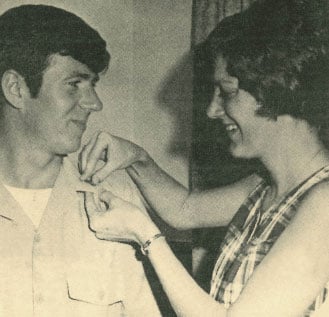 A faded newspaper article showing Brenda Potterfield pinning Second Lieutenant bars on Larry