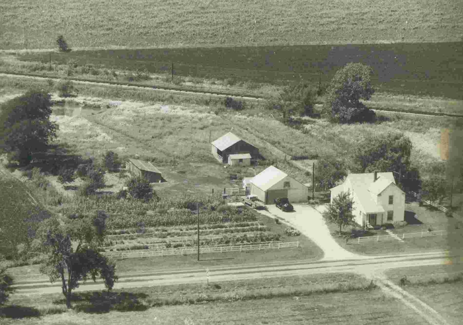 A faded, sepia image of Larry's home in Ely, Missouri