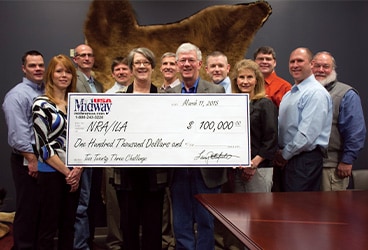 Photo of check for NRA round-up from MidwayUSA