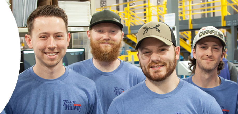 Group of smiling men in a warehouse